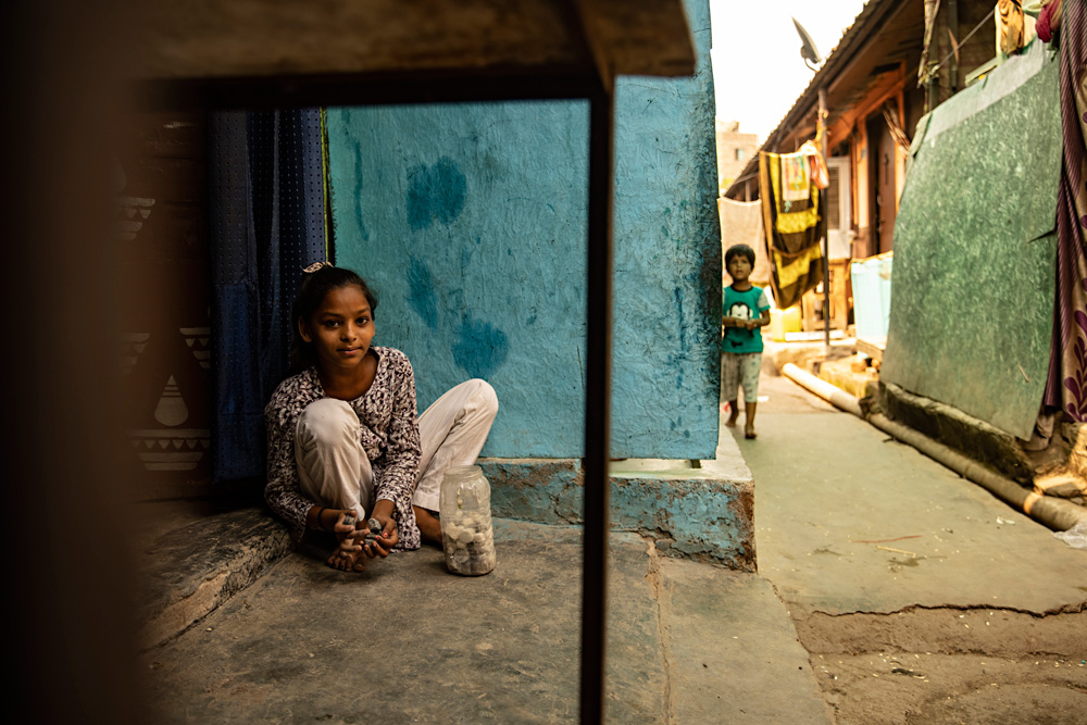 Girl playing with marbles