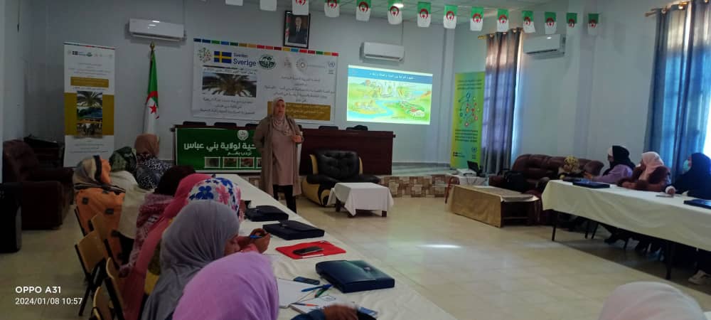 Woman speaker in front of women attendees