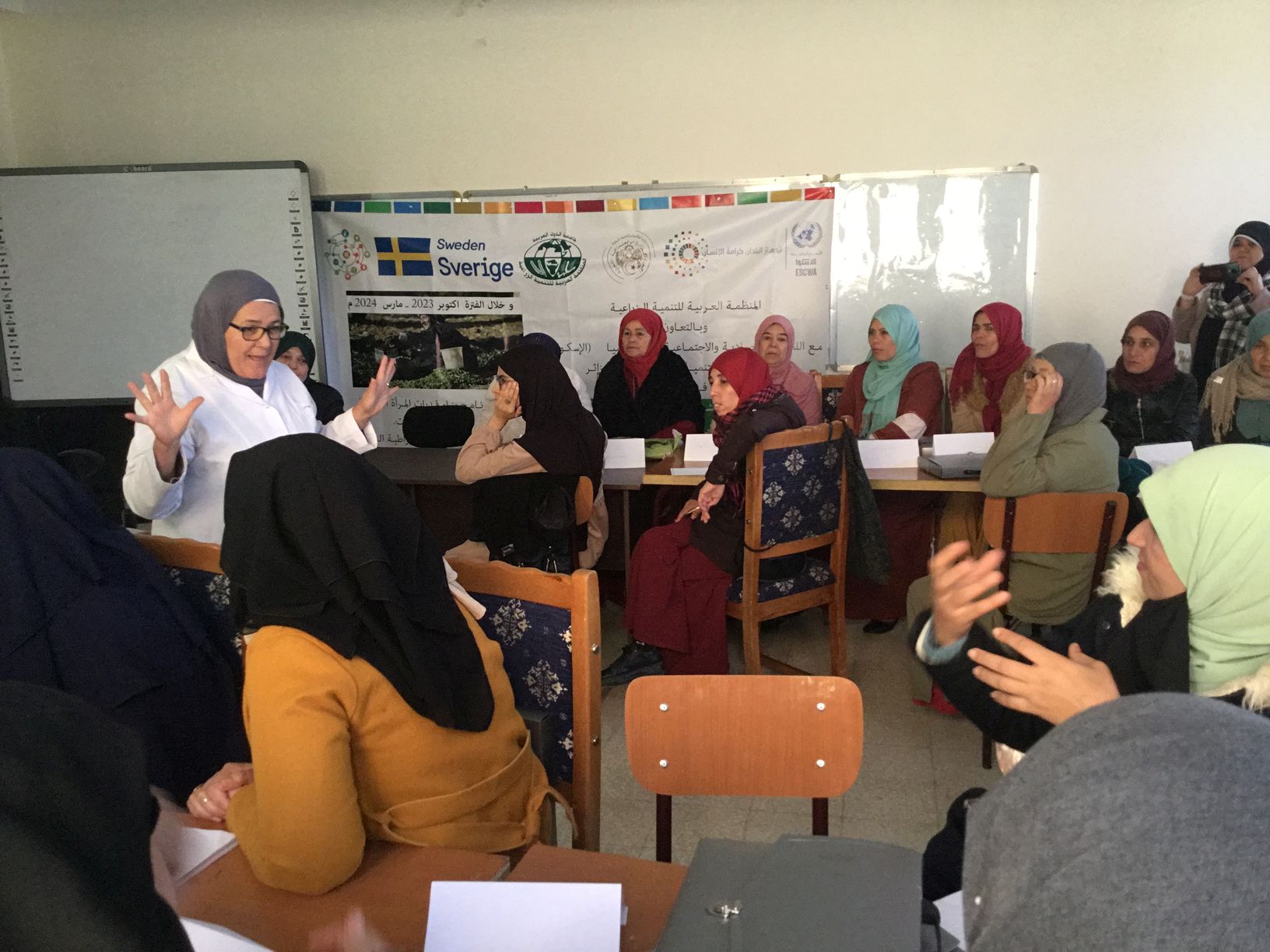 Speaker in front of rural women attendees