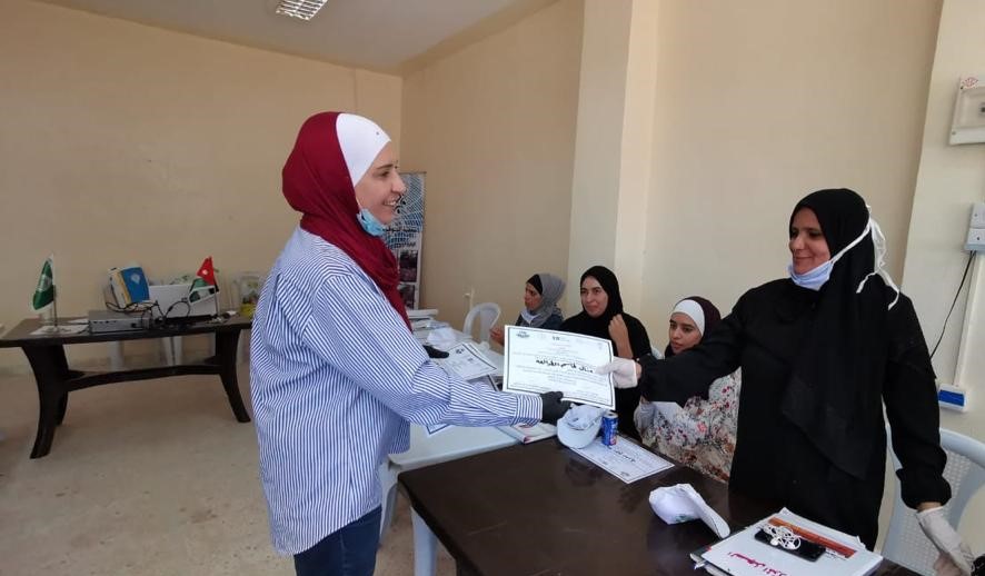 Instructor delivering a certificate of participation