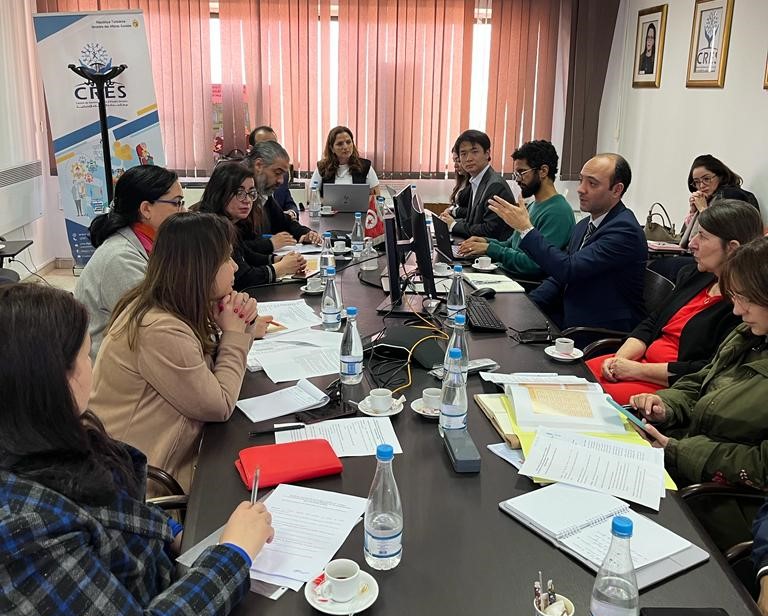 Participants around a meeting table