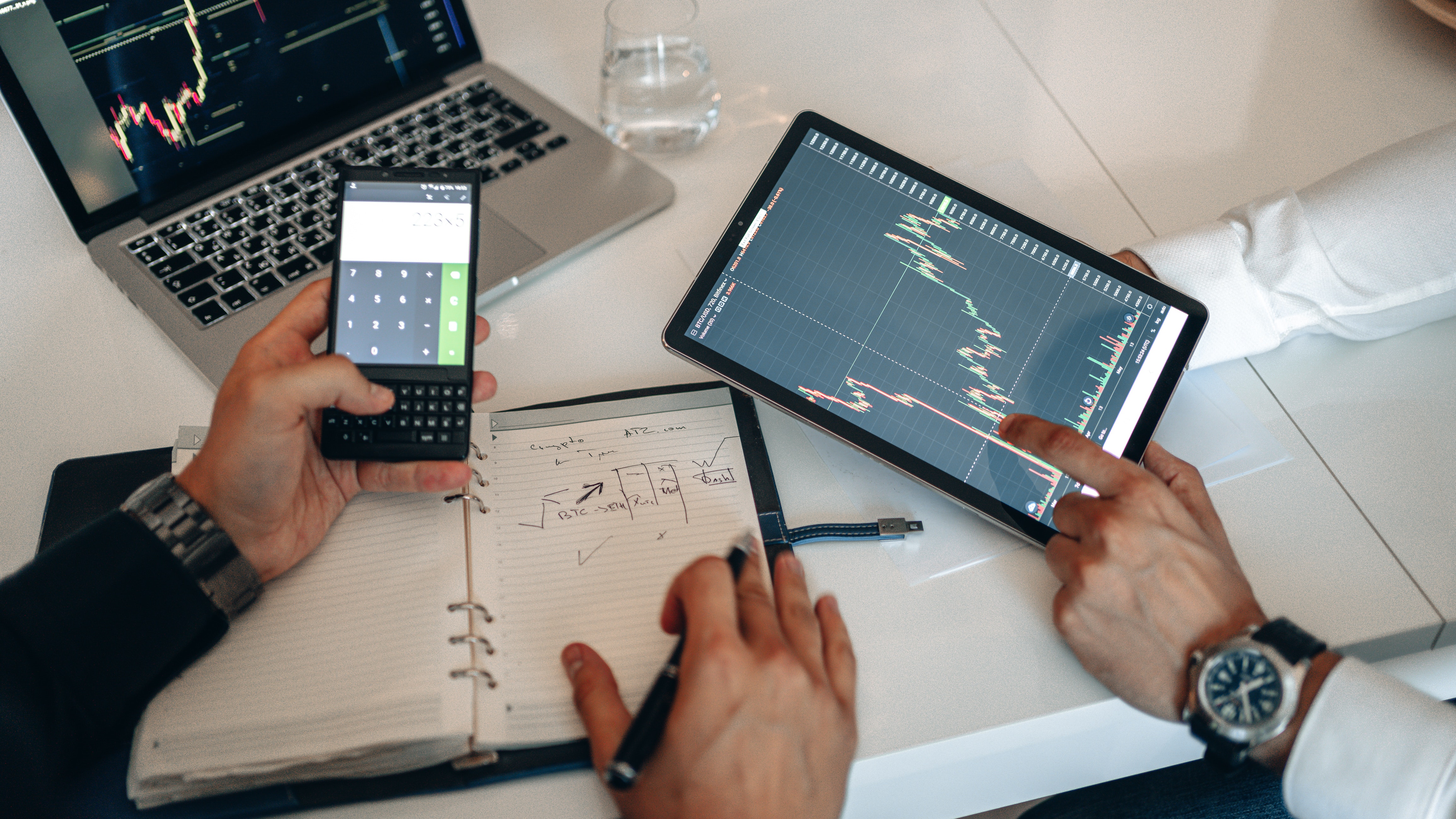 People Analyzing Data on a Digital Tablet