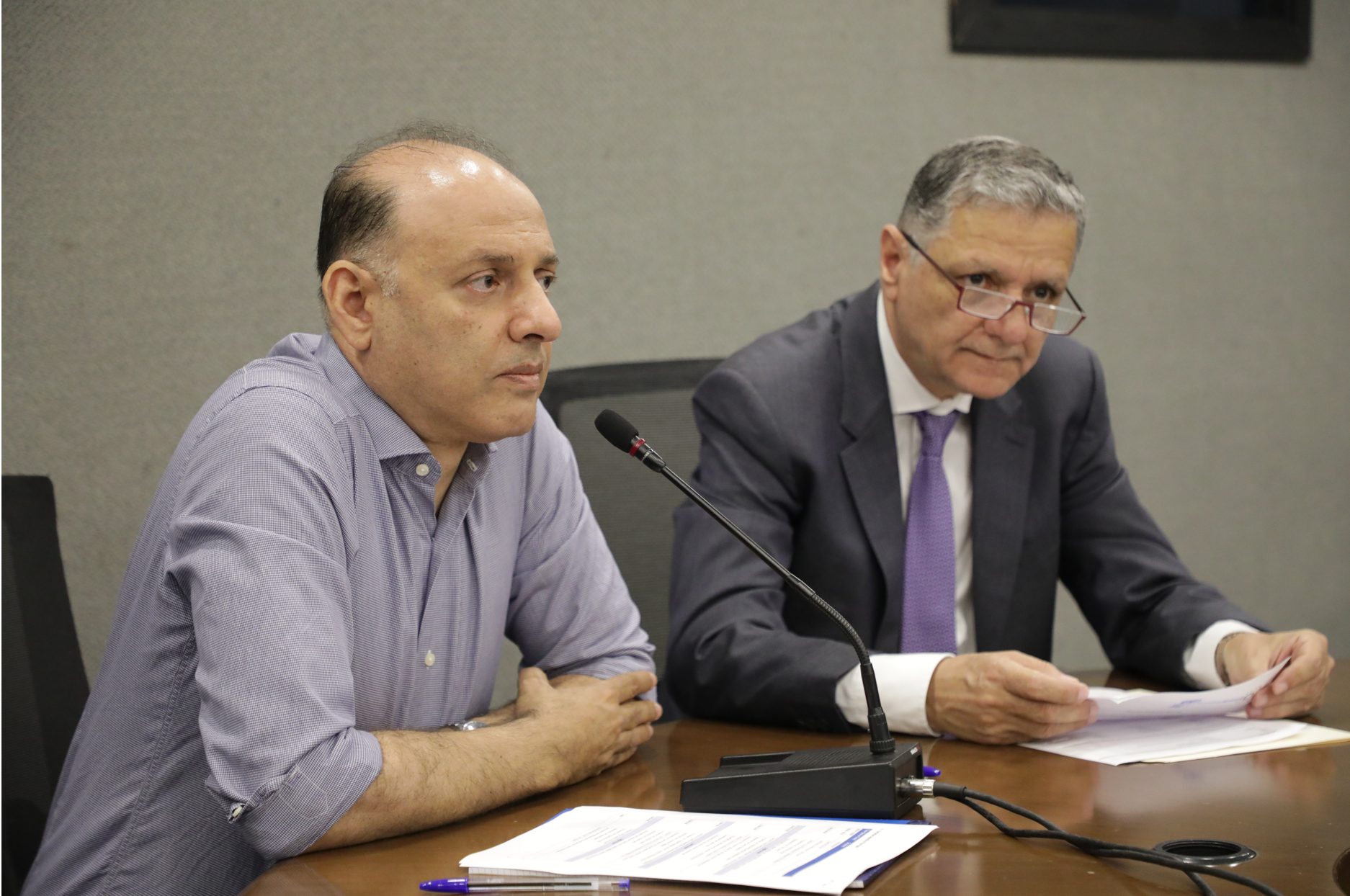 Photo of two escwa experts talking at Arab Development Challenges event