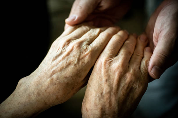 Young hands holding older hands