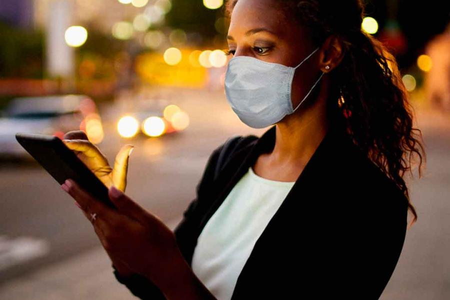 A woman using her smart phone. Photo: Steve Cole/iStock