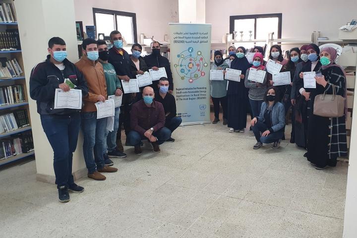 Participants holding their certificates