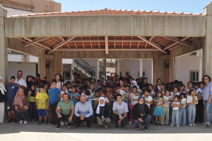 group photo in front of a school gate