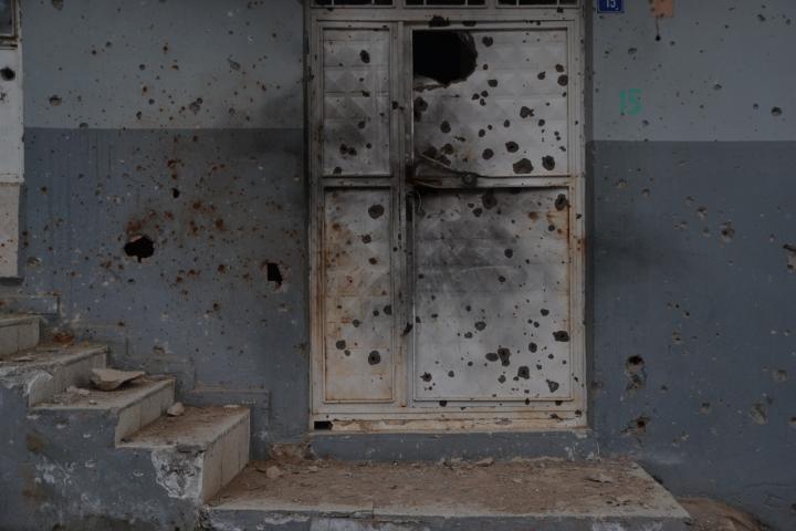 Door and stairs massively hit by bullets