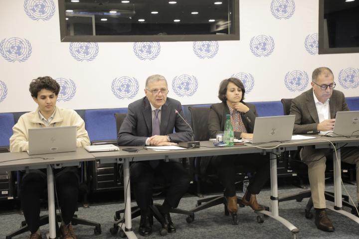 Photo of ESCWA staff holding a discussion on the draft “Yemen Vision for Recovery and Development”